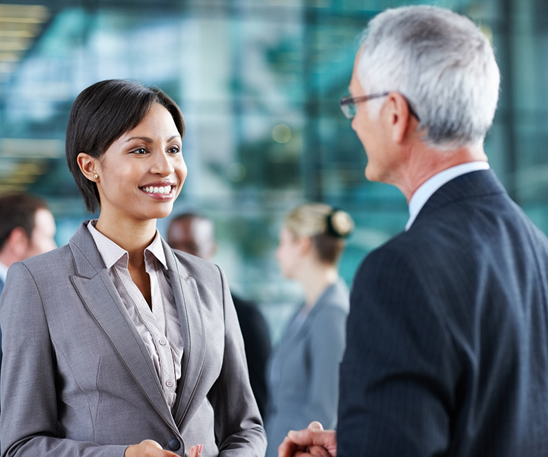 Business man sharing experiences with female executive man and woman talking